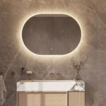 Deze ovale design spiegel van 100x70 cm is van alle gemakken voorzien, zoals: geïntegreerde directe + indirecte verlichting, spiegelverwarming, instelbare lichtkleur en een dimfunctie